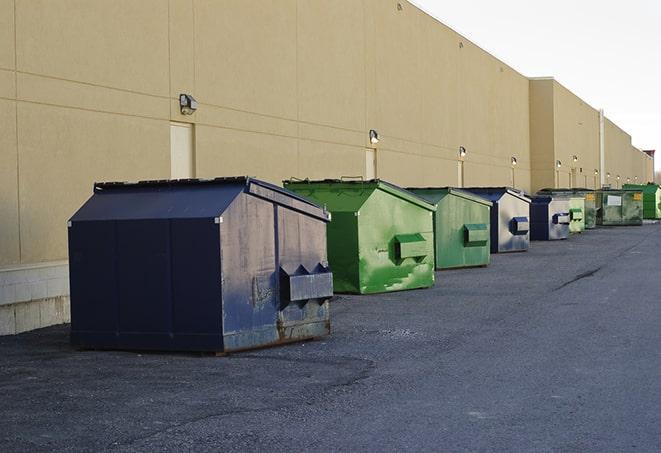 dumpsters with safety cones in a construction area in Albertson